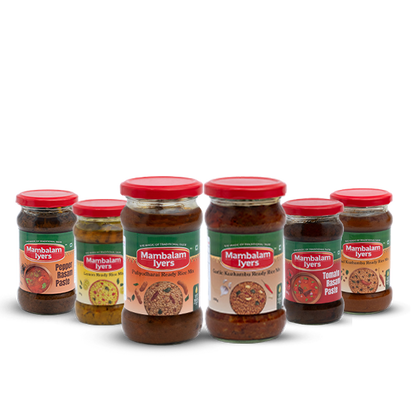 Six glass jars with red lids, each labeled with different varieties of rice mix or spice paste, arranged side by side.
